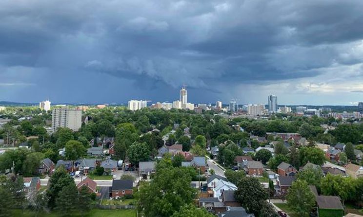 arial image of kitchener with storm clouds brewing